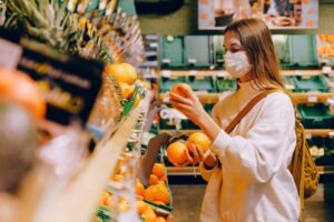 female choosing fruit in the supermarket