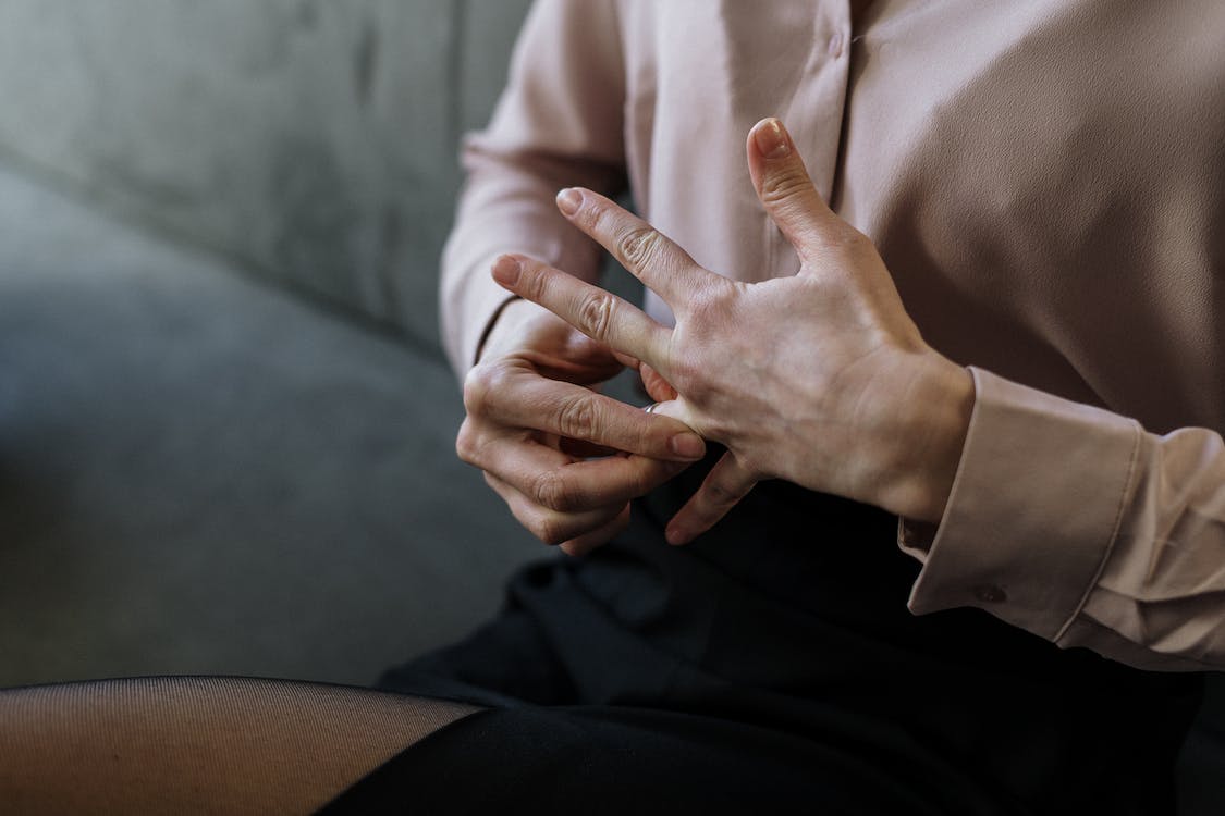 female removing wedding ring