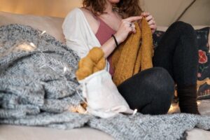 female sitting knitting