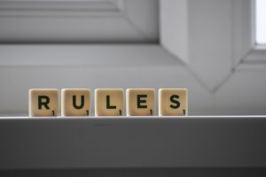 the word rules spelt out by scrabble tiles