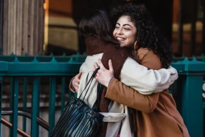 2 females hugging